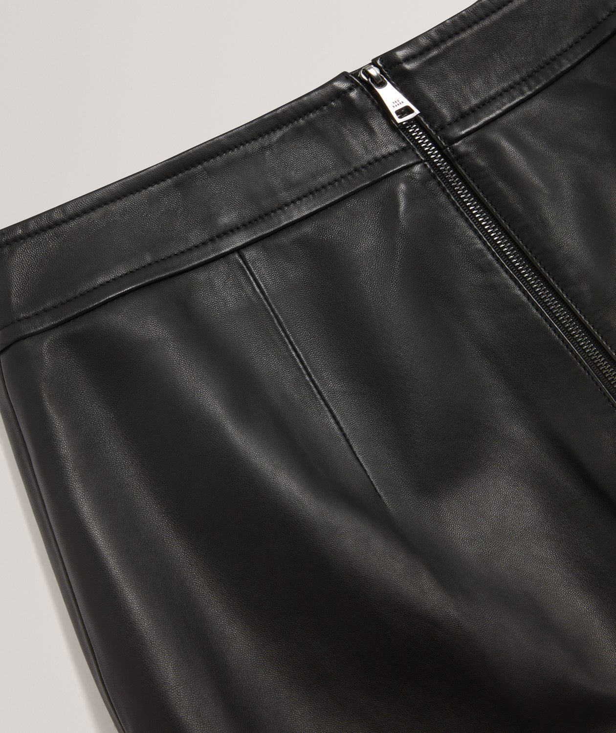 VIKTA: Leather Mini Skirt with Stitch Detail